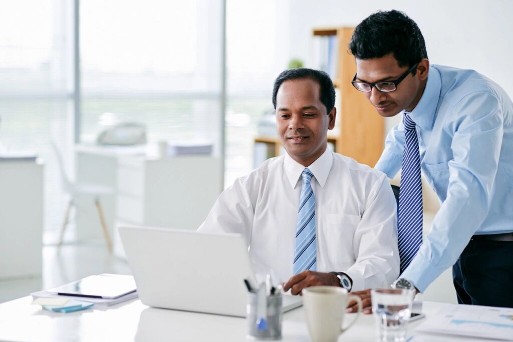 Men looking at computer screen